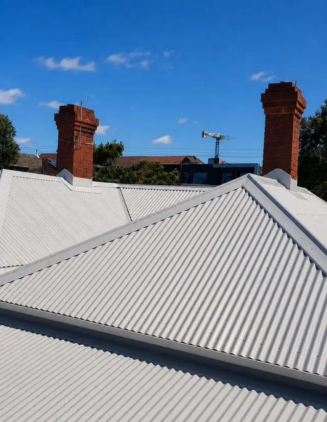 Cascone Roofing ColorBond metal roof installation with brick chimneys on a Melbourne residential re-roof