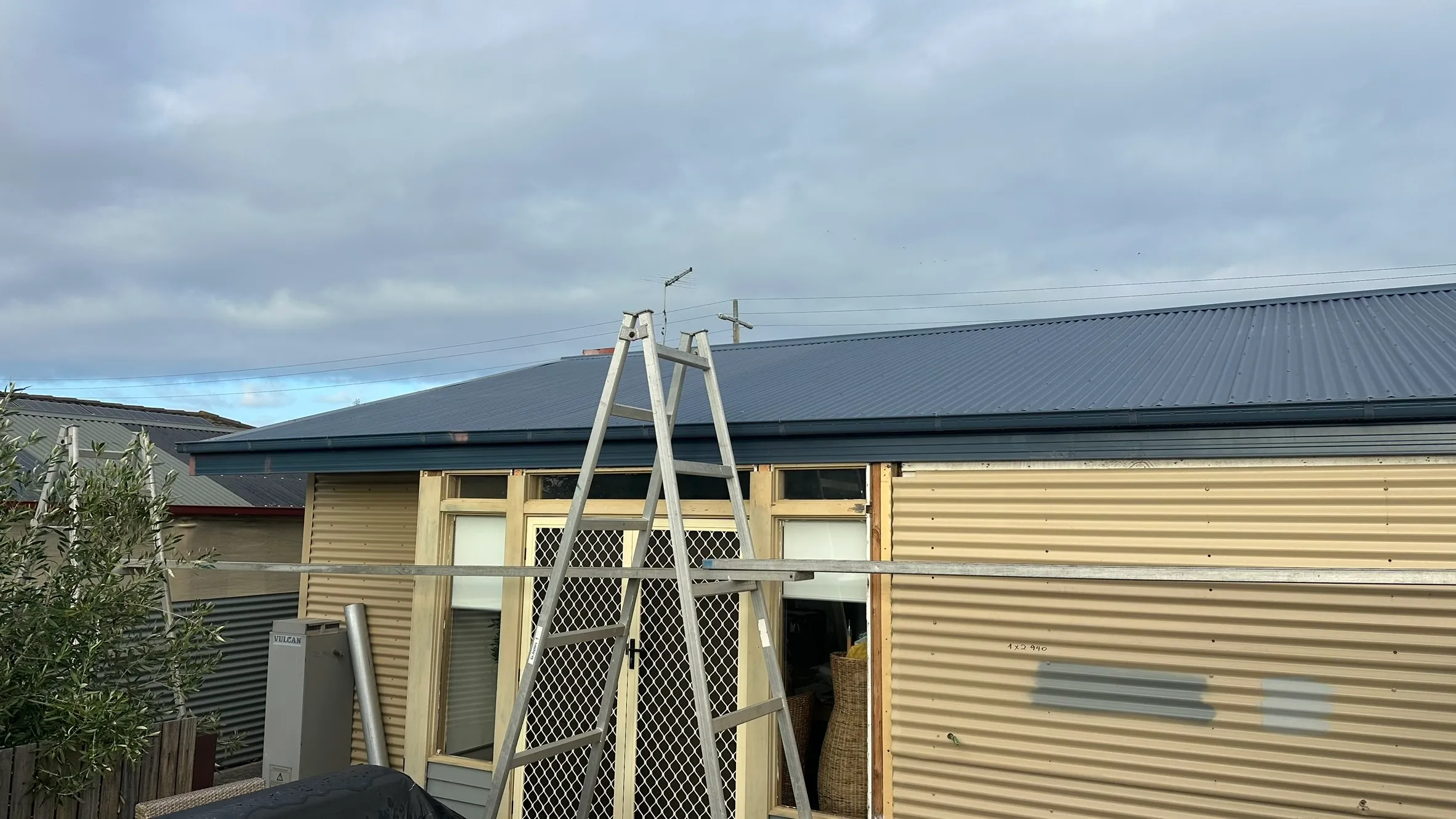 Metal gutter installation — Rosebud