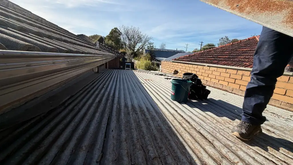 Before — aged corrugated garage roof in Fairfield prior to re-roof by Cascone Roofing