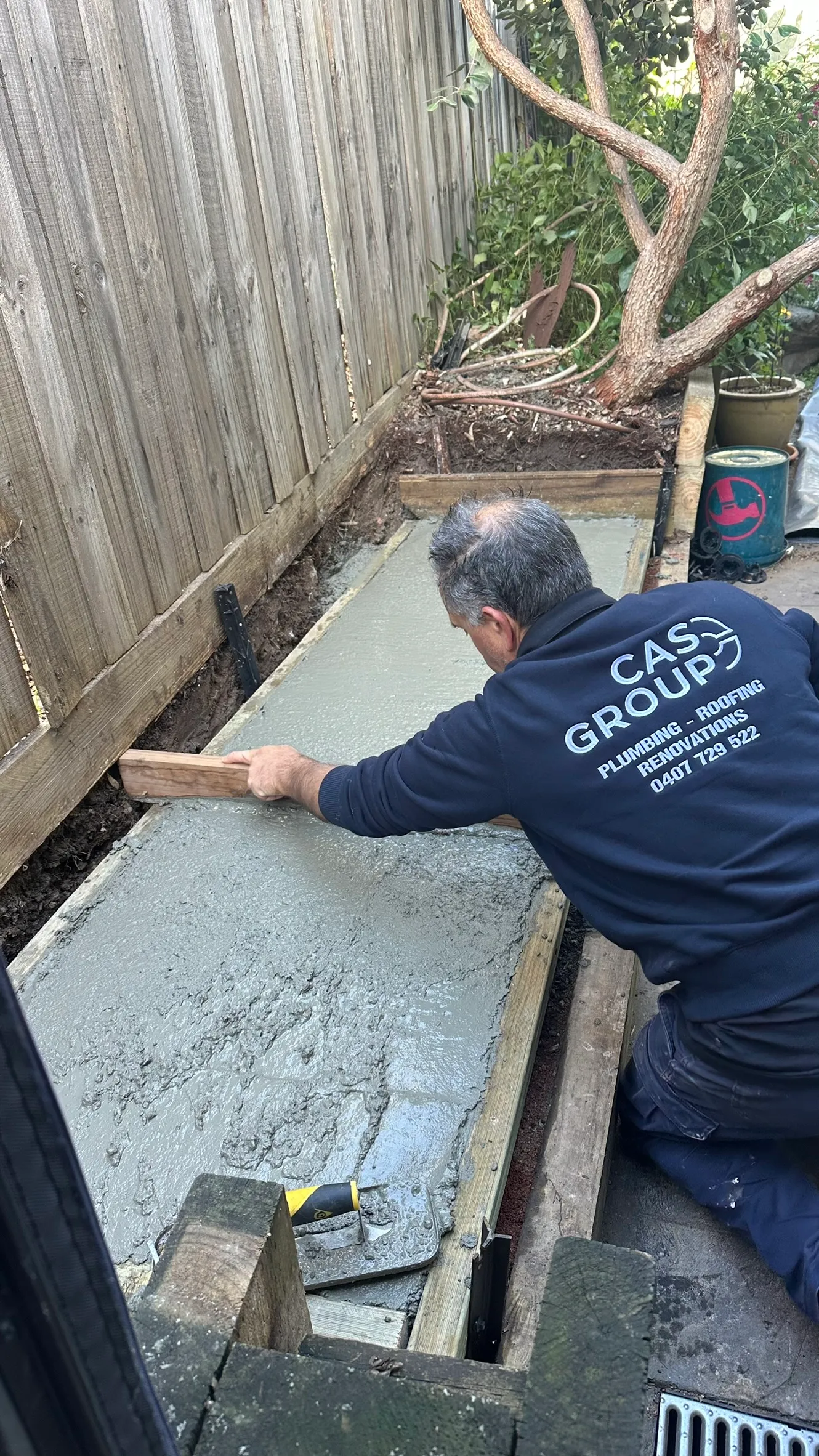 Rainwater Tank Installation Heidelberg Concrete Base — Cascone Roofing
